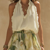 Conjunto de top con volantes y pantalones con estampado de lirios