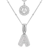Set de collares con iniciales pavé | Oro blanco