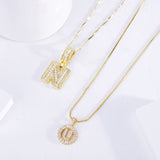 Set de collares con iniciales pavé | Oro blanco