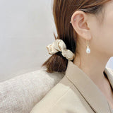 Pendientes de perlas colgantes