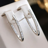 Pendientes elegantes de circonita en oro